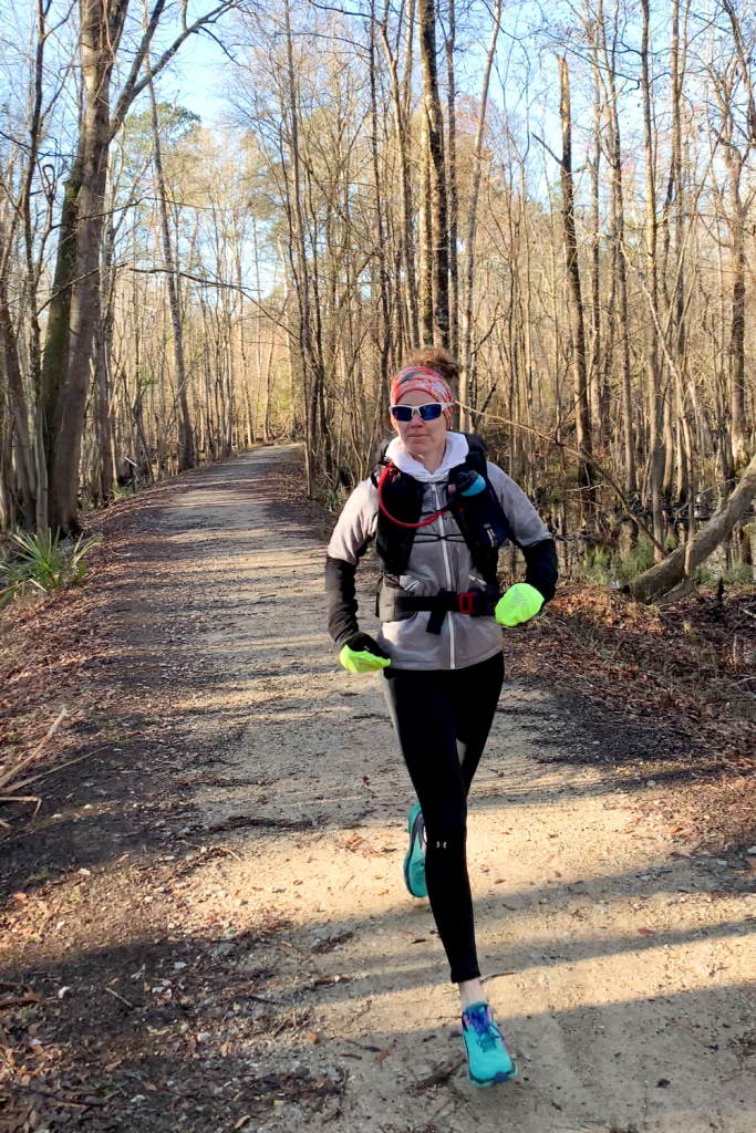 Heather Hart trail running wearing the UltrAspire Epic XT 3.0